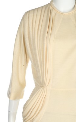 Lot 120 - A Madame Grès couture knitted cream wool...