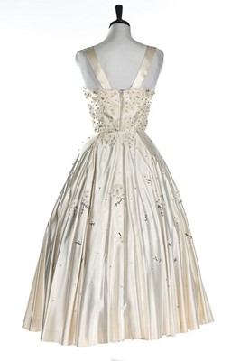 Lot 134 - A Maggy Rouff ivory satin dance/bridal gown,...
