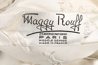 Lot 134 - A Maggy Rouff ivory satin dance/bridal gown,...