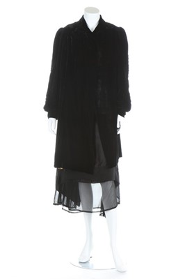 Lot 205 - A black satin cocktail gown beaded with...