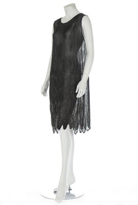 Lot 225 - A black beaded chiffon flapper dress, circa...