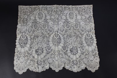 Lot 441 - A deep Brussels mixed lace bonnet veil, circa...