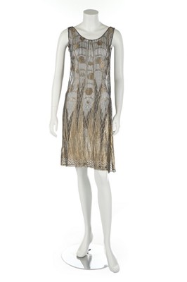 Lot 352 - A black and gold lace over-dress, late 1920s,...