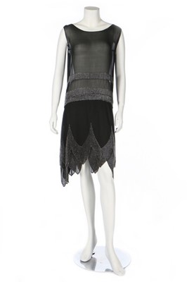 Lot 230 - A beaded black chiffon flapper dress,...