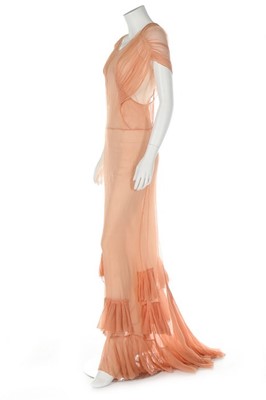 Lot 175 - A bias-cut peach chiffon evening gown, 1930s,...