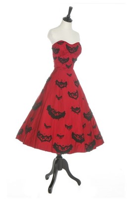 Lot 121 - An American copy of a Dior cocktail dress,...