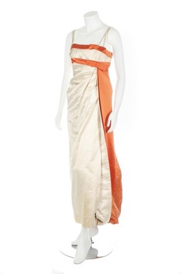 Lot 128 - A Jean Desses ivory and orange satin evening...