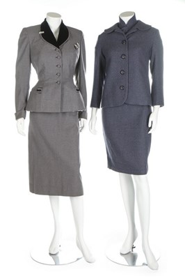 Lot 319 - A group of finely tailored suits and dresses,...