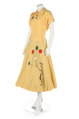 Lot 285 - A yellow cotton day-dress with novelty appliqu,...