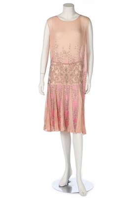 Lot 385 - A beaded pink chiffon flapper dress, mid 1920s,...