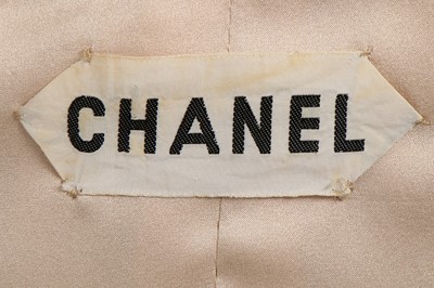 Lot 41 - A Chanel couture checked wool suit, 1969,...