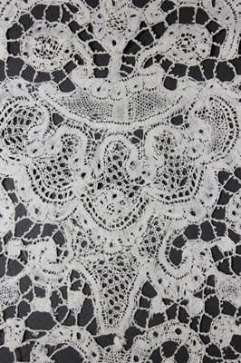 Lot 447 - A deep alb flounce of Milanese bobbin lace,...