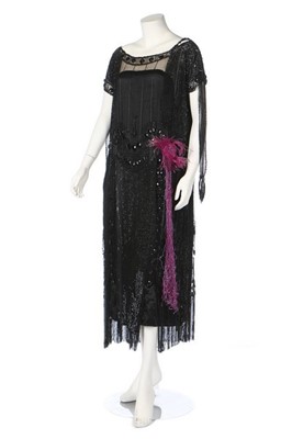 Lot 384 - A beaded and sequinned black tulle dress,...