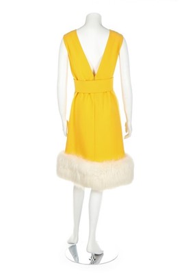 Lot 275 - A Norman Norell buttercup-yellow wool suit,...