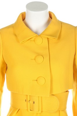 Lot 275 - A Norman Norell buttercup-yellow wool suit,...