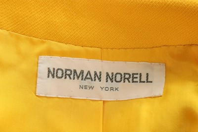 Lot 275 - A Norman Norell buttercup-yellow wool suit,...