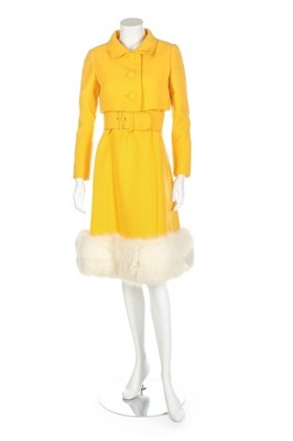 Lot 275 - A Norman Norell buttercup-yellow wool suit,...