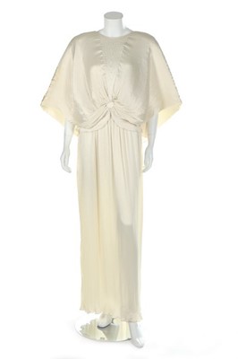 Lot 55 - A Yuki pleated ivory satin evening gown,...