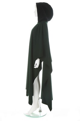 Lot 213 - An Yves Saint Laurent dark green wool cape,...