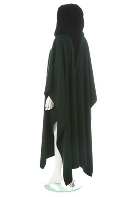 Lot 213 - An Yves Saint Laurent dark green wool cape,...