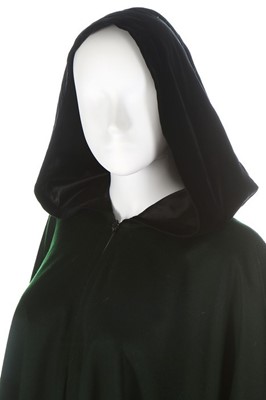 Lot 213 - An Yves Saint Laurent dark green wool cape,...