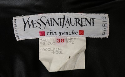 Lot 213 - An Yves Saint Laurent dark green wool cape,...