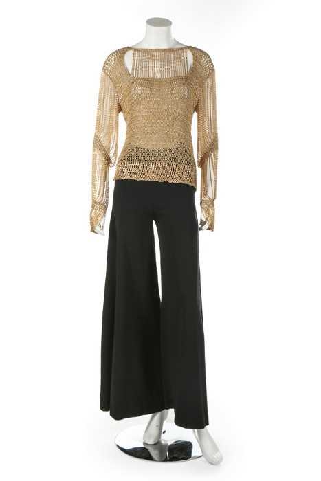 Lot 372 - A Loris Azzaro gold crochet and chain fringed...