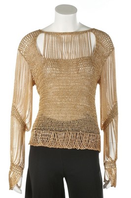 Lot 372 - A Loris Azzaro gold crochet and chain fringed...