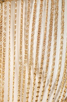 Lot 372 - A Loris Azzaro gold crochet and chain fringed...