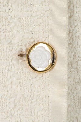 Lot 154 - A Chanel white tweed suit, late 1990s,...