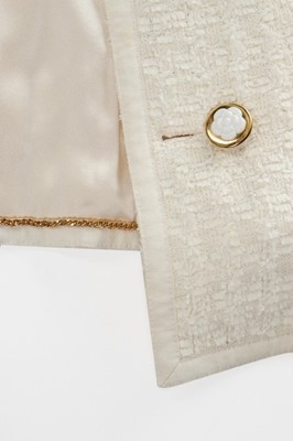 Lot 154 - A Chanel white tweed suit, late 1990s,...