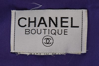 Lot 155 - A Chanel purple tweed and denim suit, 1990s,...