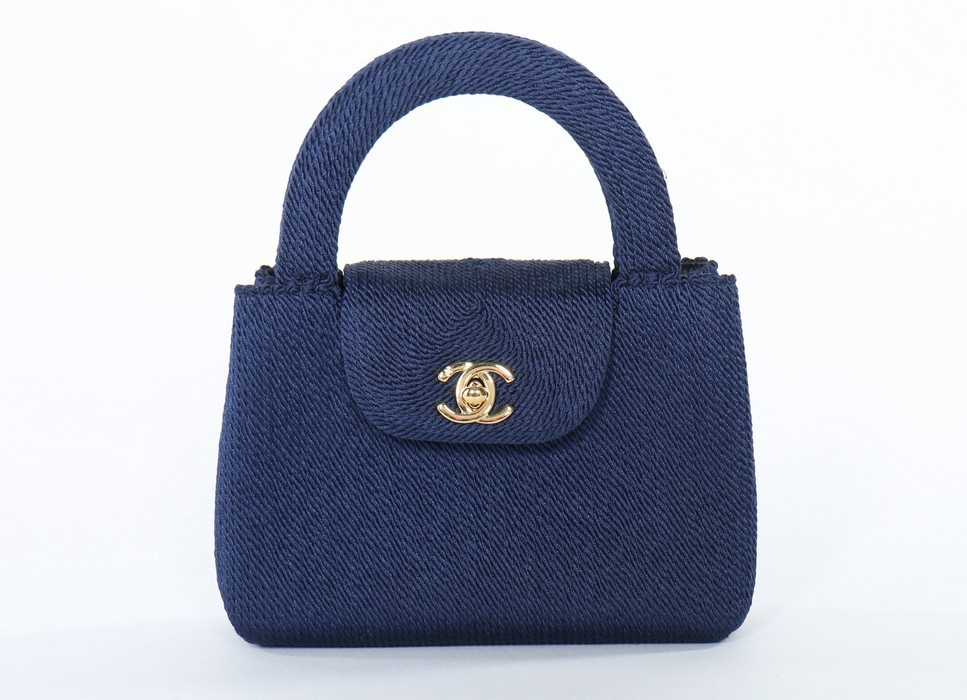 Lot 8 - A Chanel navy soutache evening bag, 1990s,