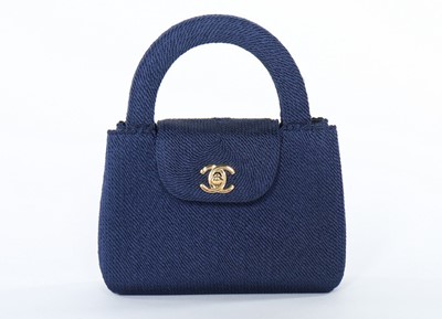 Lot 8 - A Chanel navy soutache evening bag, 1990s,...