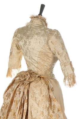 Lot 301 - An ivory damask satin wedding dress, late...