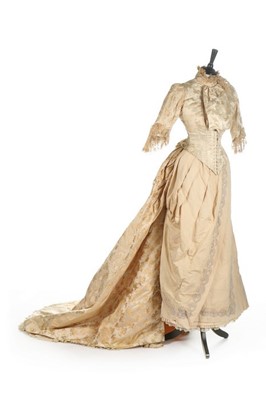 Lot 301 - An ivory damask satin wedding dress, late...