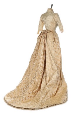Lot 301 - An ivory damask satin wedding dress, late...