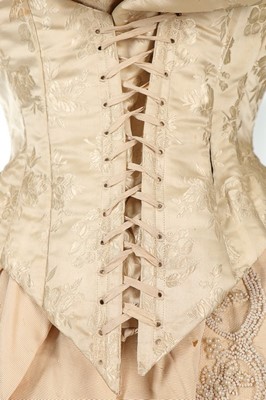 Lot 301 - An ivory damask satin wedding dress, late...