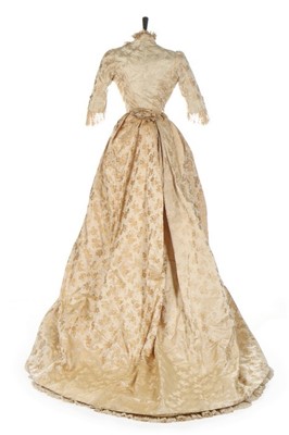 Lot 301 - An ivory damask satin wedding dress, late...