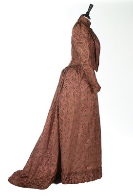 Lot 389 - A satin damask gown, 1890s, un-labelled, woven...