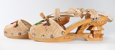 Lot 286 - A pair of Hawaiian carved wooden wedge sandals,...