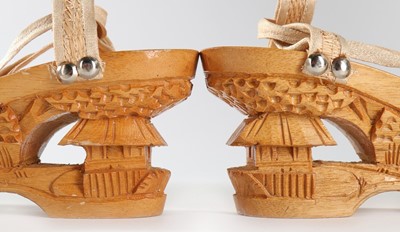 Lot 286 - A pair of Hawaiian carved wooden wedge sandals,...