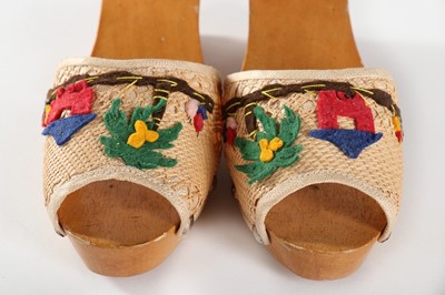 Lot 286 - A pair of Hawaiian carved wooden wedge sandals,...