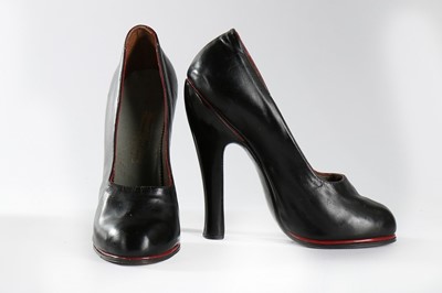 Lot 317 - A pair of black leather fetish shoes, circa...