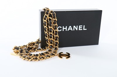 Lot 202 - A Chanel gilt chain belt woven with leather,...