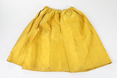 Lot 299 - A Chinese-yellow satin quilted petticoat, mid...