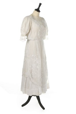 Lot 200 - A whiteworked muslin dress, circa 1918,...