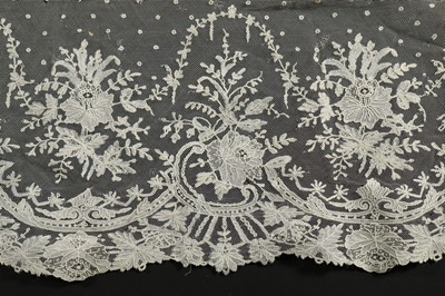 Lot 400 - A tulle bridal veil edged in 1860s Brussels...