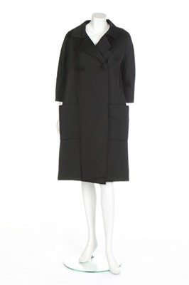 Lot 130 - A Balenciaga couture black silk faille coat,...