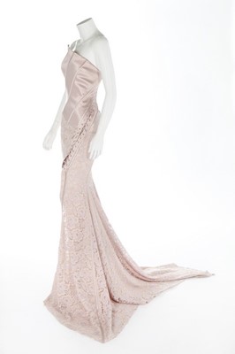 Lot 337 - A John Galliano pink satin and lace gown, 2000,...